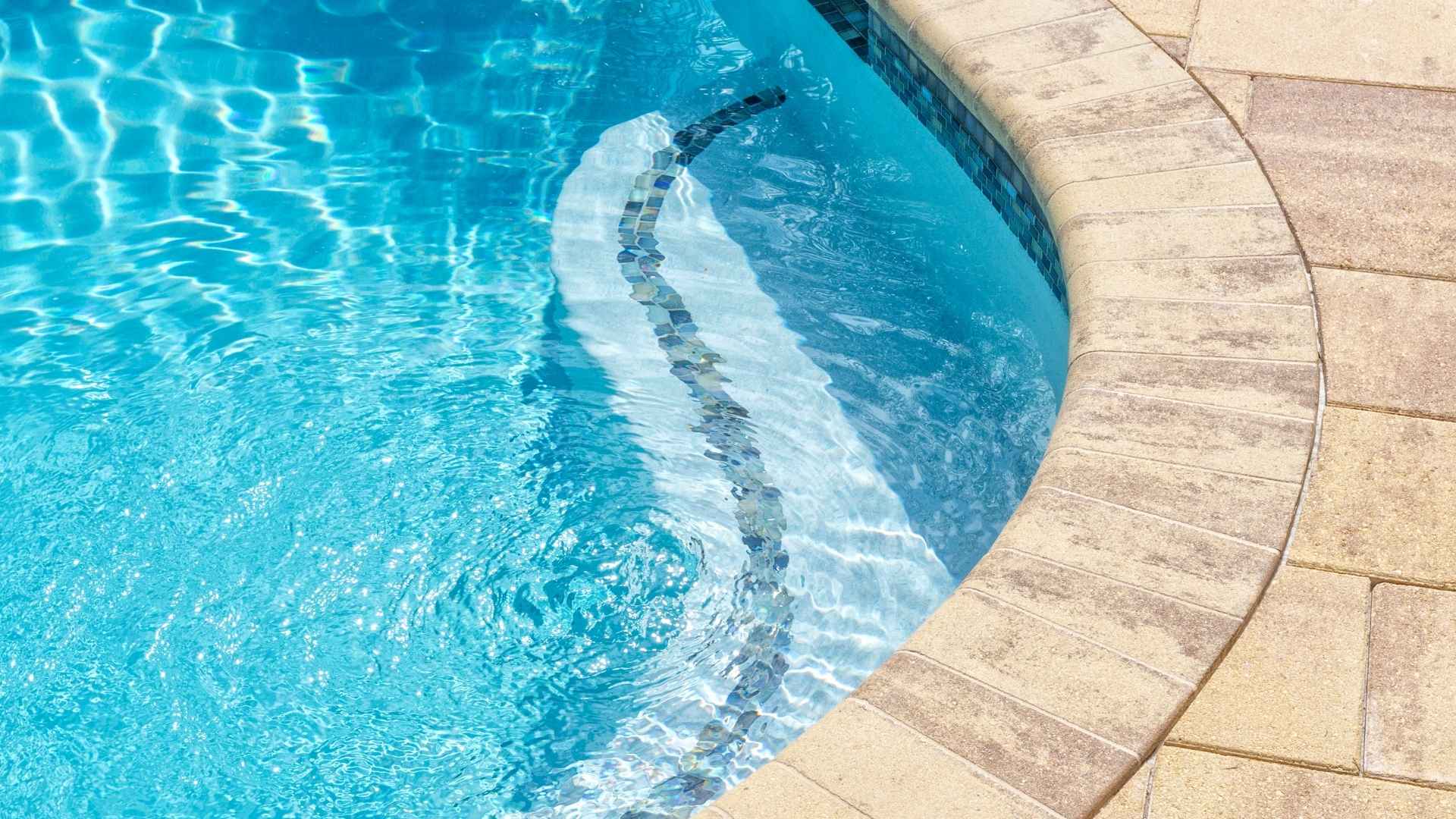 Clear pool water with curved edge