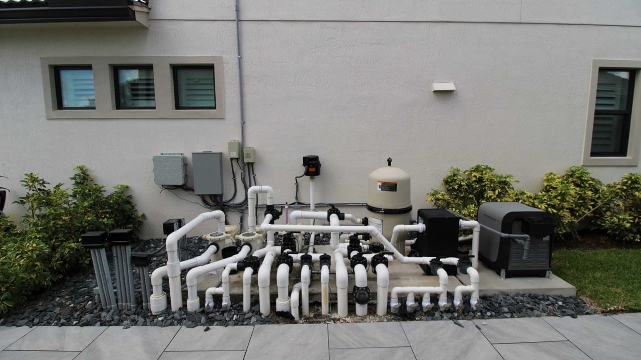 Pool equipment installation with pumps, filters, valves and organized plumbing